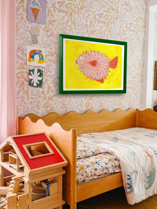 Child's bedroom featuring a wooden bed, colorful bedding, and a vibrant fish painting on the wall.