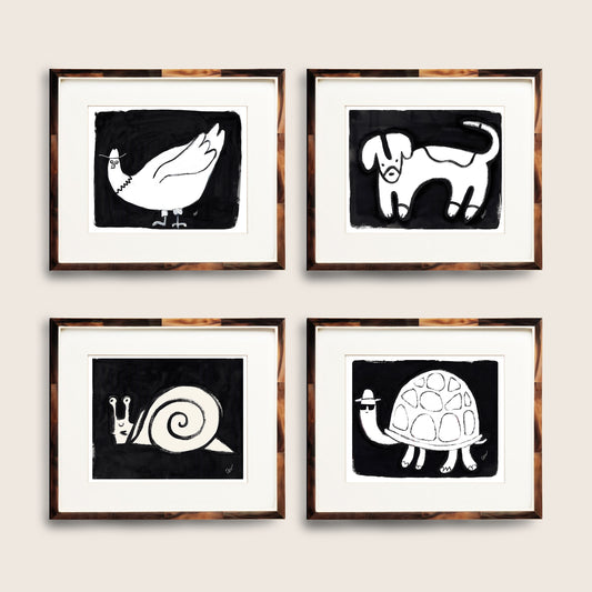 Four framed black and white animal illustrations featuring a duck, dog, snail, and turtle.
