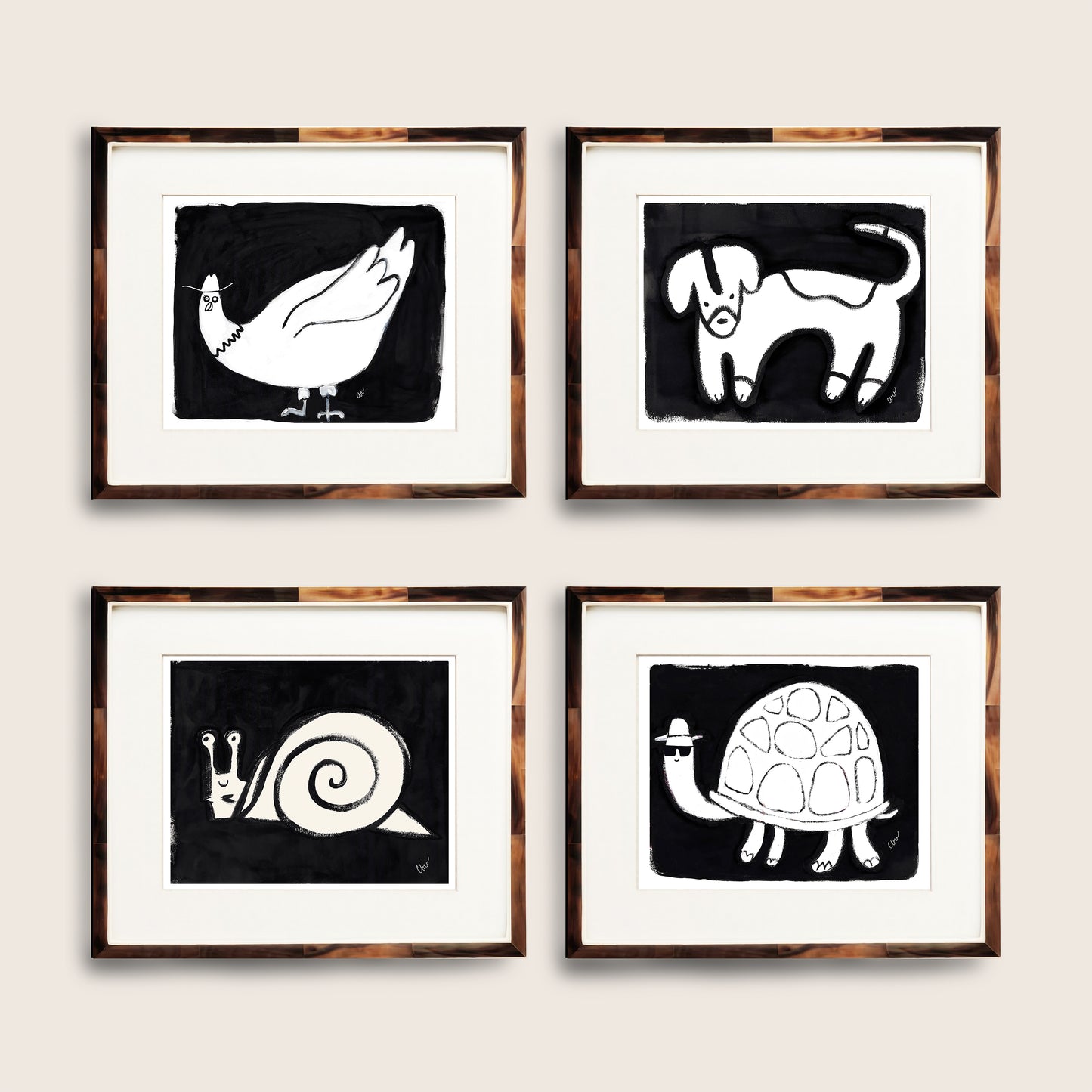 Four framed animal illustrations featuring a duck, dog, snail, and turtle on a neutral background.