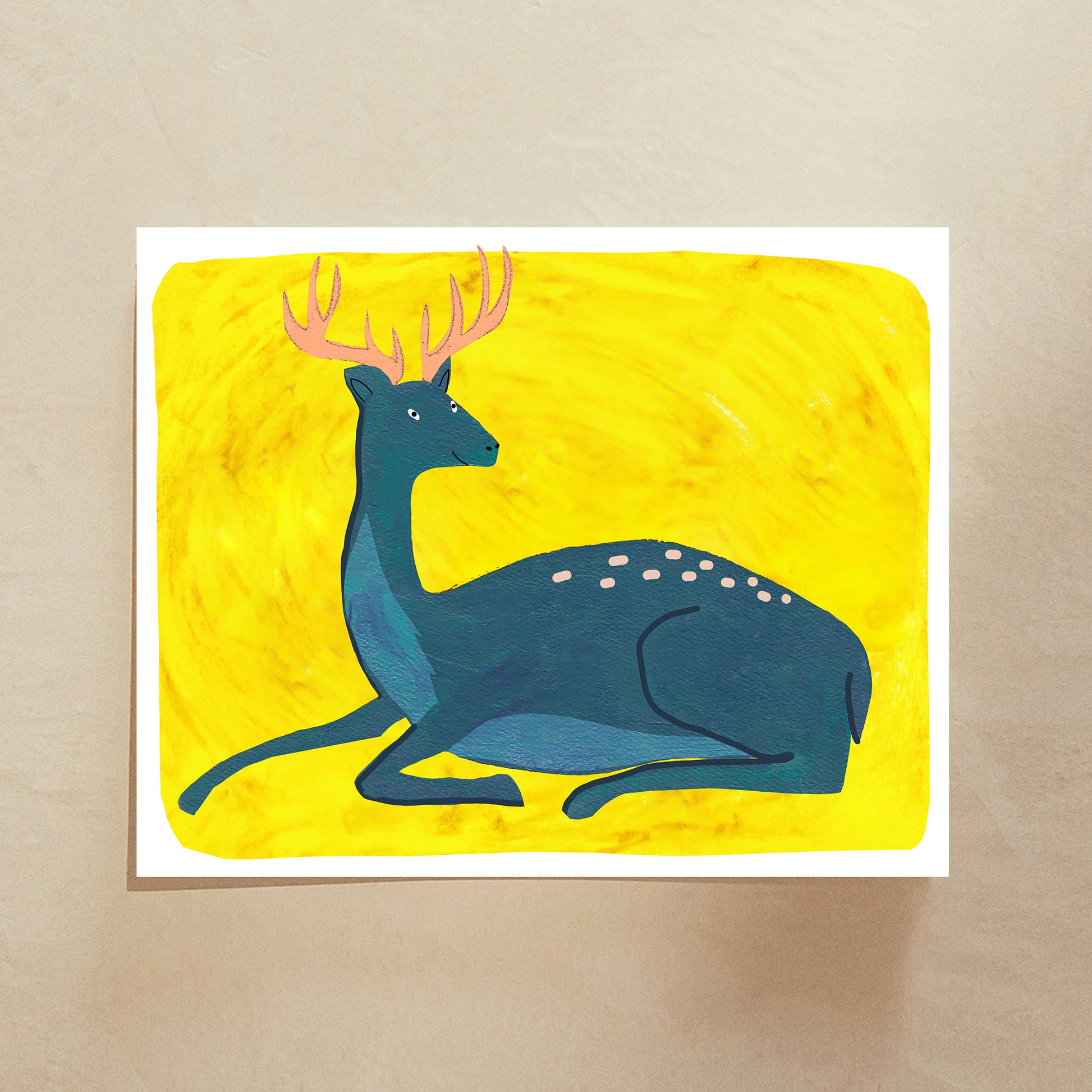 A stylized illustration of a blue deer with antlers reclining against a bright yellow background.