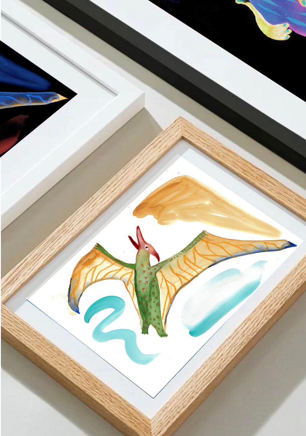 Colorful artwork of a bird framed among other pieces