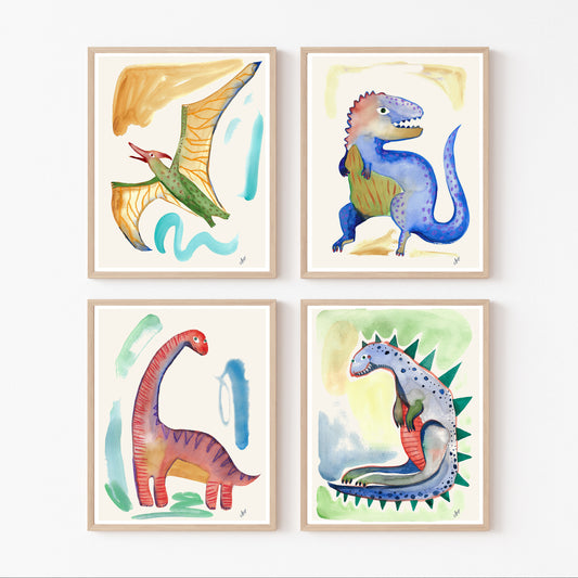 Four colorful watercolor dinosaur illustrations in framed prints