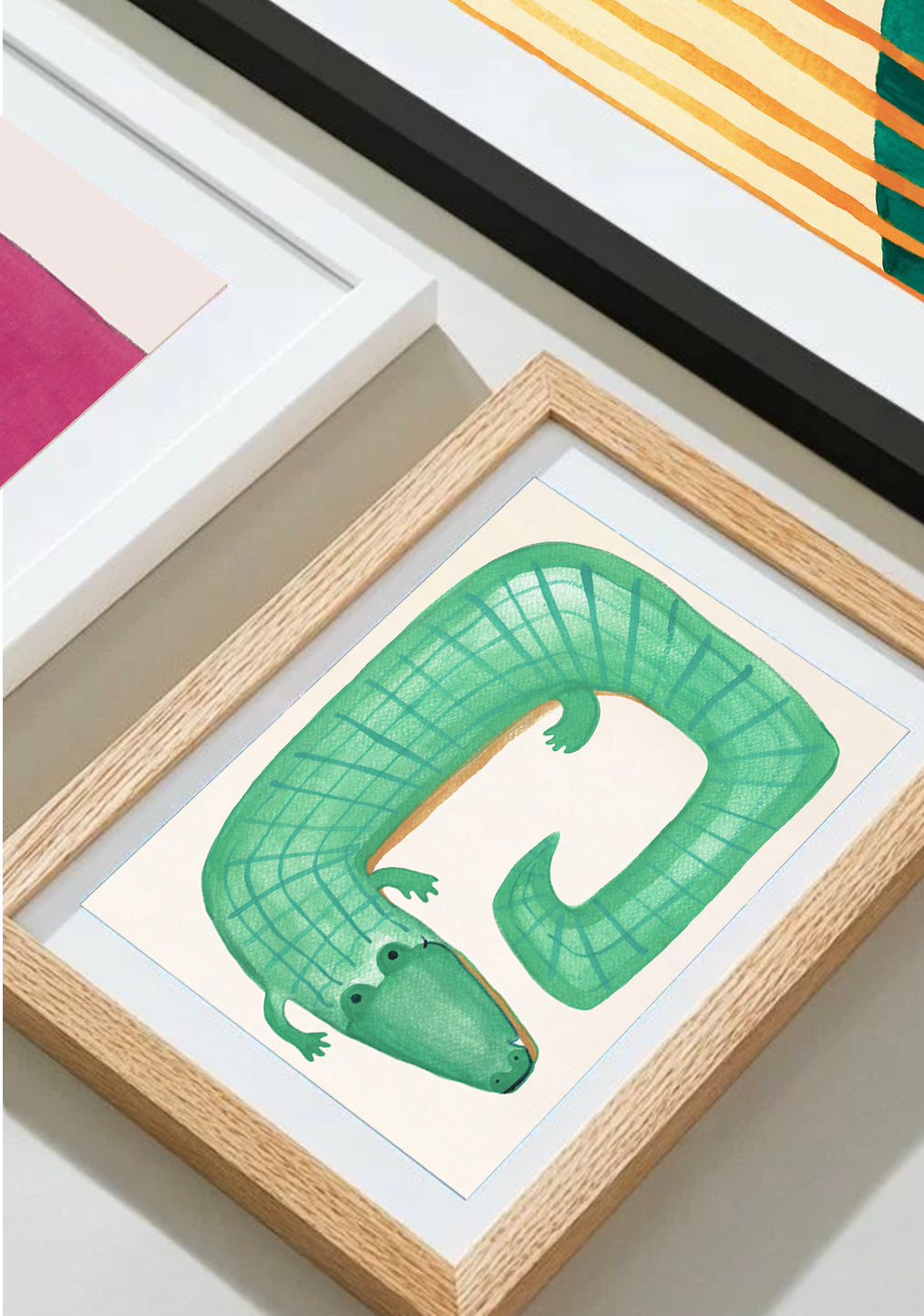 A framed illustration of a green crocodile with a grid pattern.