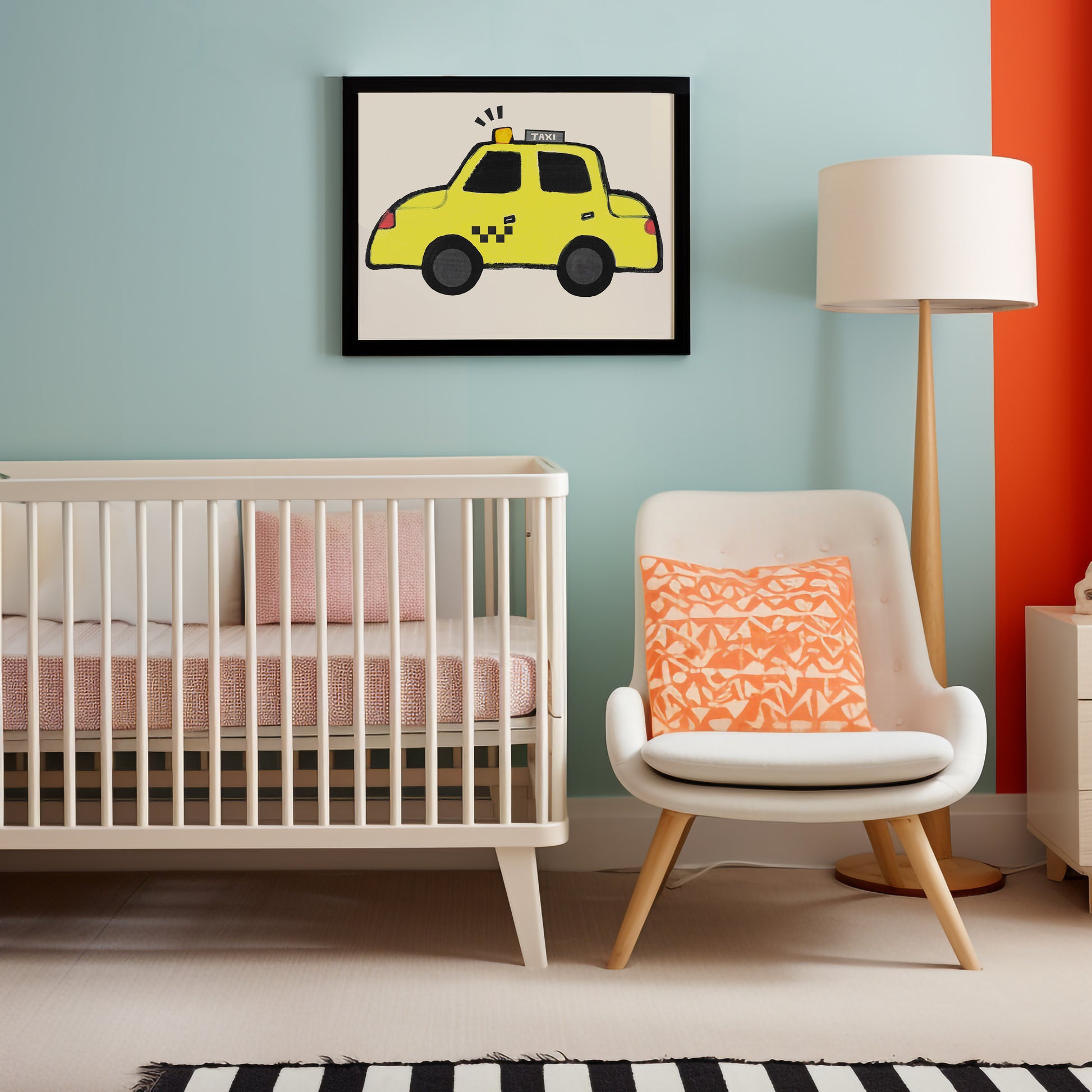 Nursery featuring a crib, a modern chair with an orange patterned pillow, a lamp, and a framed illustration of a yellow taxi on the wall.