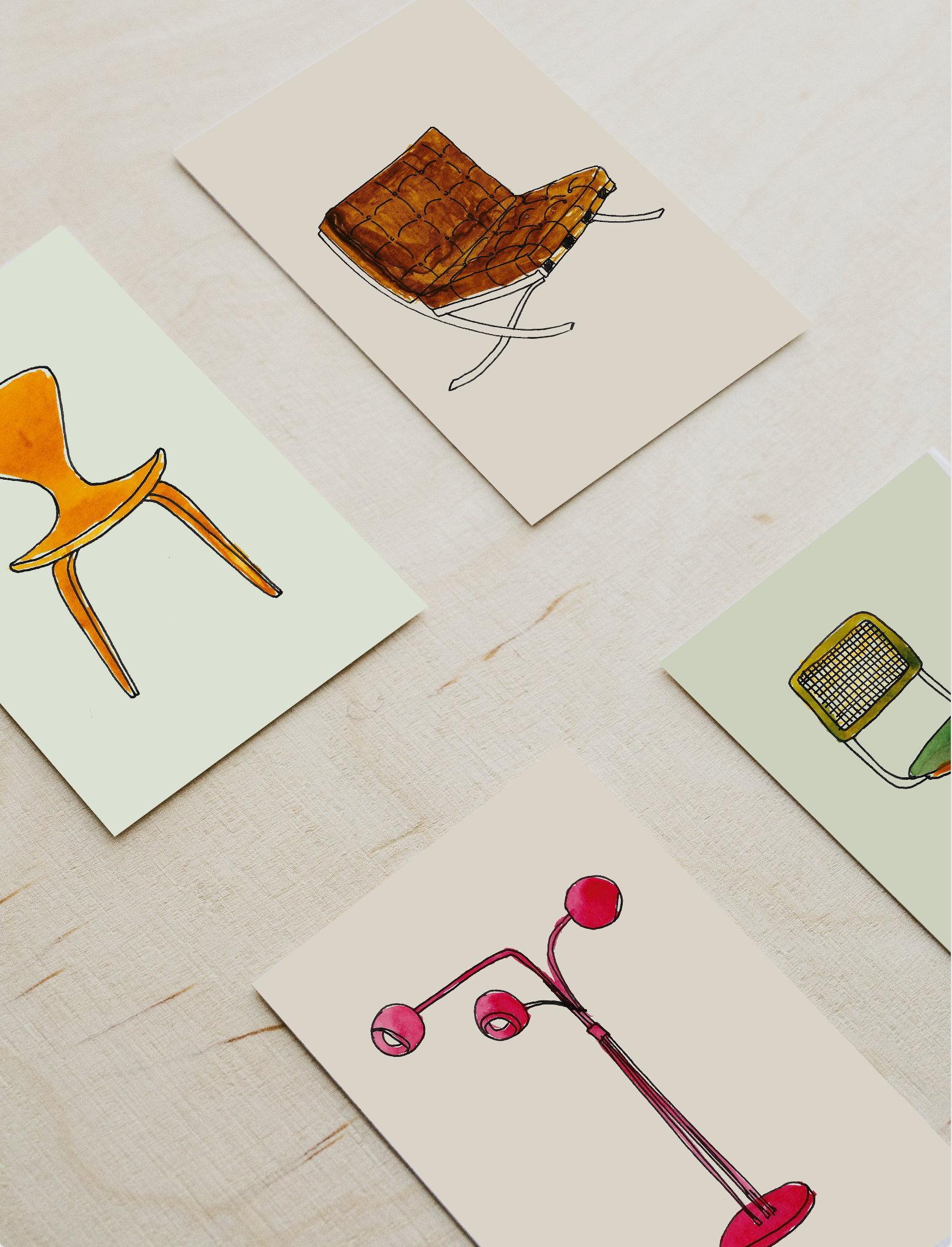 Illustrations of various furniture items on cards, including a chair and a lamp.
