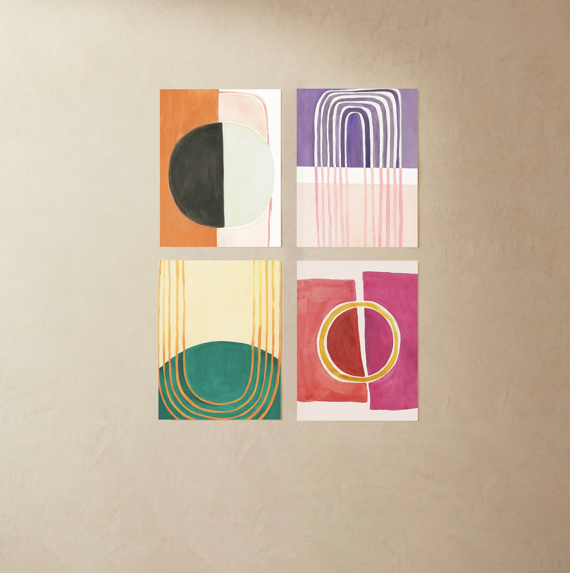 Four abstract geometric art pieces in various colors on a neutral background.