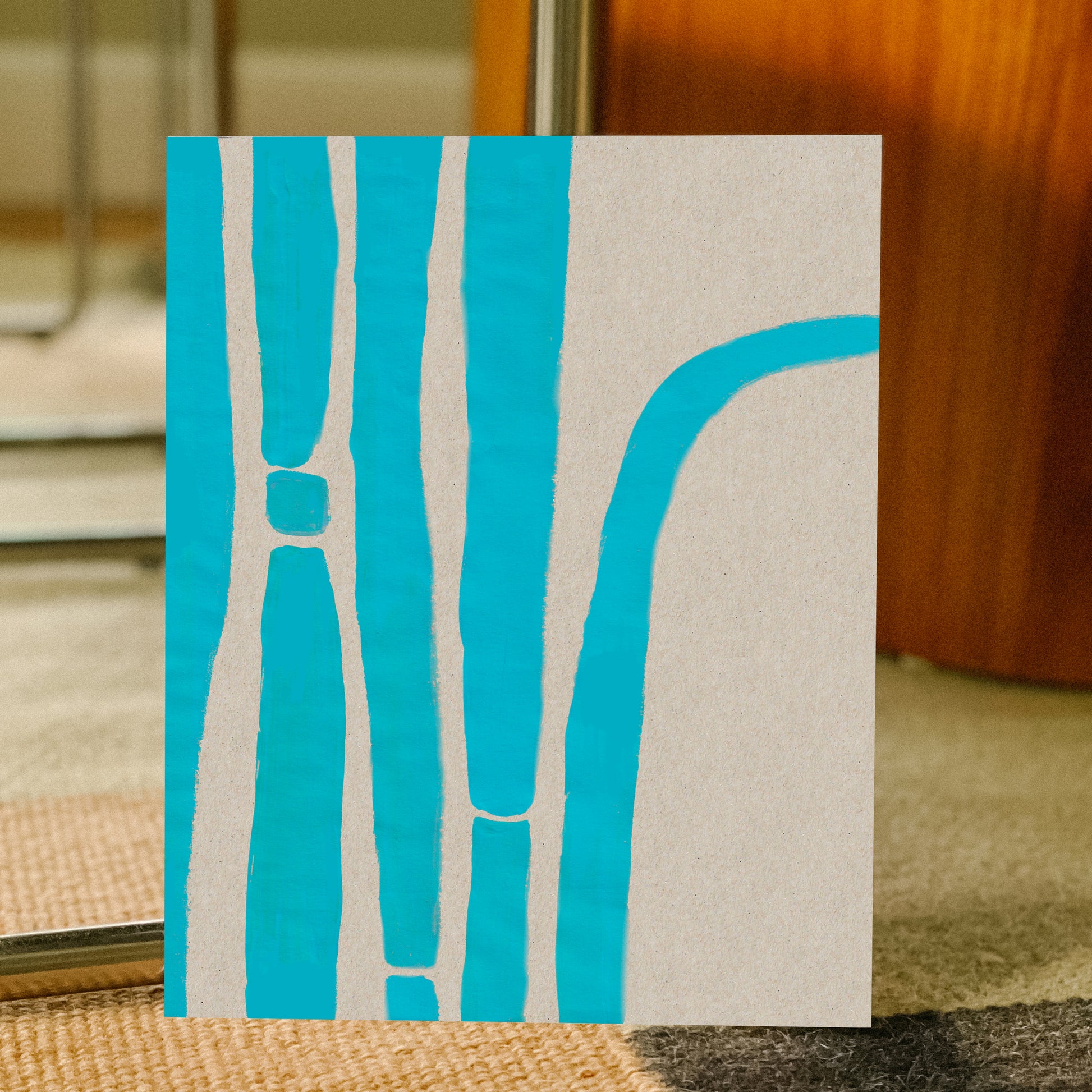 Abstract art with blue lines on a beige background.